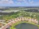 Aerial view of a suburban neighborhood surrounded by lush green trees at 7228 Great Egret Blvd, Sarasota, FL 34241