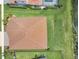 Aerial view of the home's roof and manicured backyard, near a serene lake at 7228 Great Egret Blvd, Sarasota, FL 34241