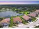 Aerial view of multiple homes with ponds in a beautiful suburban community at 7228 Great Egret Blvd, Sarasota, FL 34241