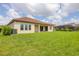Spacious backyard with covered patio, ideal for outdoor entertaining and relaxation at 7228 Great Egret Blvd, Sarasota, FL 34241