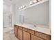 Bathroom featuring double vanity, large mirror, and a glass-enclosed shower, creating a functional space at 7228 Great Egret Blvd, Sarasota, FL 34241