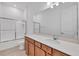 Bright bathroom featuring double sink vanity with lots of cabinet space, large mirror, tile floor and recessed lighting at 7228 Great Egret Blvd, Sarasota, FL 34241