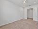 Bedroom has carpet, ceiling fan, and a closet with doors, providing a functional space at 7228 Great Egret Blvd, Sarasota, FL 34241