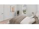 This bedroom features a modern design with neutral carpet, contemporary decor, and a cozy atmosphere at 7228 Great Egret Blvd, Sarasota, FL 34241