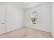 Bright bedroom featuring neutral carpet, ceiling fan and lots of natural light from the window at 7228 Great Egret Blvd, Sarasota, FL 34241