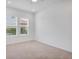 Bright bedroom showcasing natural light from the windows and neutral finishes at 7228 Great Egret Blvd, Sarasota, FL 34241