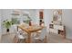 Cozy dining room with contemporary decor, a wood table, and carpet flooring at 7228 Great Egret Blvd, Sarasota, FL 34241