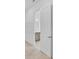 Hallway view of the bathroom with double sink vanity and tile floor, offering a peek into the home's stylish interior at 7228 Great Egret Blvd, Sarasota, FL 34241
