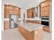 Spacious kitchen featuring a large island, granite countertops, and stainless steel appliances at 7228 Great Egret Blvd, Sarasota, FL 34241