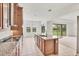 Modern kitchen with a center island, granite counters, stainless steel appliances, and view of backyard at 7228 Great Egret Blvd, Sarasota, FL 34241