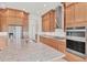 Modern kitchen island with granite countertops and stainless steel appliances at 7228 Great Egret Blvd, Sarasota, FL 34241