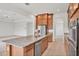 Open kitchen featuring a large island, granite countertops, and seamless flow to other living spaces at 7228 Great Egret Blvd, Sarasota, FL 34241
