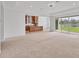 Open-concept living area with view of the backyard and a modern kitchen layout at 7228 Great Egret Blvd, Sarasota, FL 34241