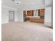 Expansive open concept living room with recessed lighting, neutral decor, and a modern kitchen at 7228 Great Egret Blvd, Sarasota, FL 34241
