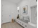 Well-organized mudroom with built-in bench, storage cubbies, and stylish decor at 7228 Great Egret Blvd, Sarasota, FL 34241