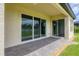 Covered patio featuring brick flooring and tranquil views, perfect for relaxing outdoors at 7228 Great Egret Blvd, Sarasota, FL 34241