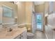 Bright bathroom featuring a vanity sink and a door with access to a pool at 7464 Ridge Rd, Sarasota, FL 34238