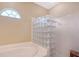 Stylish bathroom featuring a walk-in glass block shower and natural light at 7464 Ridge Rd, Sarasota, FL 34238