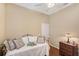 Comfortable bedroom featuring a twin bed, soft pillows and a dark wooden nightstand at 7464 Ridge Rd, Sarasota, FL 34238