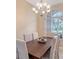 Elegant dining room with a wooden table and chairs and a large window at 7464 Ridge Rd, Sarasota, FL 34238