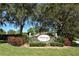 Stonebridge community sign surrounded by lush landscaping and mature trees at 7464 Ridge Rd, Sarasota, FL 34238