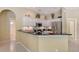 Beautiful kitchen featuring granite counters, white cabinets, and stainless steel appliances at 7464 Ridge Rd, Sarasota, FL 34238