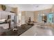 Open kitchen with granite countertops, stainless steel appliances, and a view of the dining area at 7464 Ridge Rd, Sarasota, FL 34238