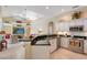 Well-equipped kitchen with granite countertops, stainless steel appliances, and adjacent breakfast nook at 7464 Ridge Rd, Sarasota, FL 34238