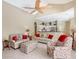 Comfortable living room featuring neutral tones, comfortable seating, and a view of the kitchen at 7464 Ridge Rd, Sarasota, FL 34238