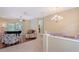 Bright living room with hardwood floors, piano, and sliding glass doors to the patio at 7464 Ridge Rd, Sarasota, FL 34238