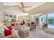 Open-concept living room and kitchen area with comfortable seating, a breakfast nook, and access to the pool at 7464 Ridge Rd, Sarasota, FL 34238