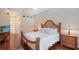 Comfortable main bedroom featuring a king bed and dark wood floors at 7464 Ridge Rd, Sarasota, FL 34238