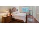 Serene bedroom features a king bed, side tables, and an outside view that offers a peaceful retreat at 7464 Ridge Rd, Sarasota, FL 34238