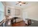 Bright office space with a black desk, cabinets, and views from the window at 7464 Ridge Rd, Sarasota, FL 34238