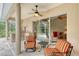 Covered patio with outdoor kitchen and access to the screened pool at 7464 Ridge Rd, Sarasota, FL 34238