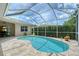The screened-in pool area offers privacy with nice landscaping at 7464 Ridge Rd, Sarasota, FL 34238