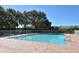 Community pool featuring a brick paver deck and a white fence surrounding the pool at 7464 Ridge Rd, Sarasota, FL 34238