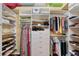 Organized walk-in closet with shelves, drawers, and hanging space for efficient storage and organization at 7464 Ridge Rd, Sarasota, FL 34238