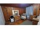 Cozy bedroom with warm wood paneling, offering a serene and inviting space for relaxation and rest at 809 30Th E Ave, Bradenton, FL 34208