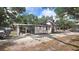 Charming single-story home features a carport and a spacious driveway in a tranquil, tree-filled neighborhood at 809 30Th E Ave, Bradenton, FL 34208