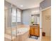 Bright bathroom featuring a large soaking tub and glass enclosed shower at 8168 Villa Grande Ct, Sarasota, FL 34243
