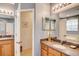 Dual vanities in a bathroom with granite counters at 8168 Villa Grande Ct, Sarasota, FL 34243