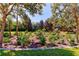 Landscaped community playground area surrounded by trees at 8168 Villa Grande Ct, Sarasota, FL 34243