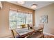 Dining room features lots of natural light and seating for four with a backyard view at 8168 Villa Grande Ct, Sarasota, FL 34243