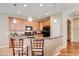 Eat-in kitchen features granite counters, pendant lights, and stainless appliances at 8168 Villa Grande Ct, Sarasota, FL 34243