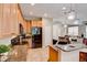 The kitchen offers an island with bar seating, granite countertops, and stainless appliances at 8168 Villa Grande Ct, Sarasota, FL 34243