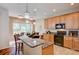 Eat-in kitchen with granite counters, stainless appliances, and barstool seating at 8168 Villa Grande Ct, Sarasota, FL 34243