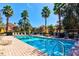 Community swimming pool with chairs and shade umbrellas at 8168 Villa Grande Ct, Sarasota, FL 34243