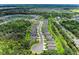 Aerial view of the community featuring beautiful homes and scenic ponds showcasing the neighborhood's serene atmosphere at 8721 Firefly Pl, Parrish, FL 34219
