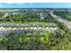 A beautiful aerial view of the property and neighborhood showing greenbelts and other community residences at 8721 Firefly Pl, Parrish, FL 34219